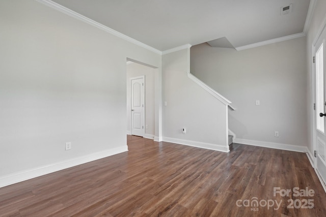 interior space featuring ornamental molding and dark hardwood / wood-style flooring