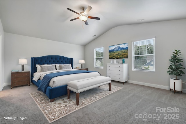 bedroom featuring ceiling fan, light colored carpet, vaulted ceiling, and multiple windows