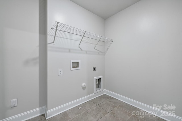 laundry area with tile patterned flooring, hookup for an electric dryer, hookup for a gas dryer, and hookup for a washing machine