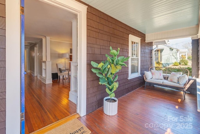 wooden terrace with a porch