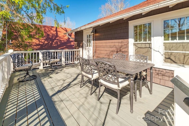 wooden deck featuring outdoor dining space