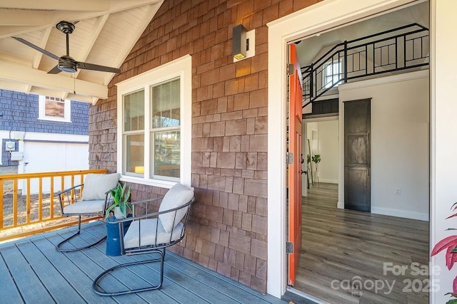 wooden deck with ceiling fan and a porch