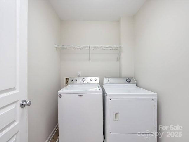 washroom with laundry area and independent washer and dryer