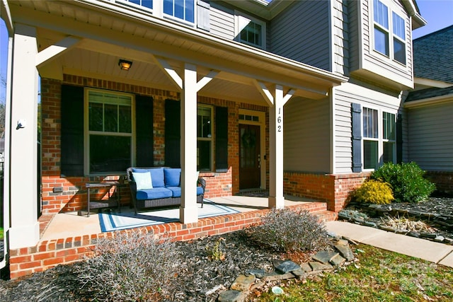 entrance to property featuring a porch