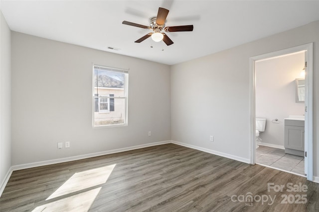 505 Kings Mountain St, Clover, SC 29710 - unfurnished bedroom featuring ceiling fan, light wood-type flooring, and ensuite bath