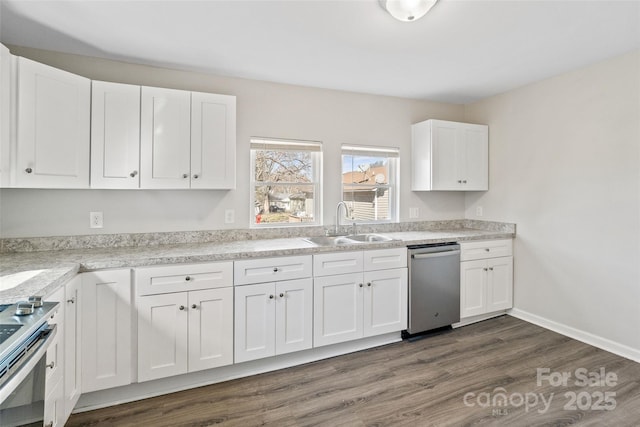505 Kings Mountain St, Clover, SC 29710 - kitchen featuring dark hardwood / wood-style flooring, sink, white cabinets, and appliances with stainless steel finishes