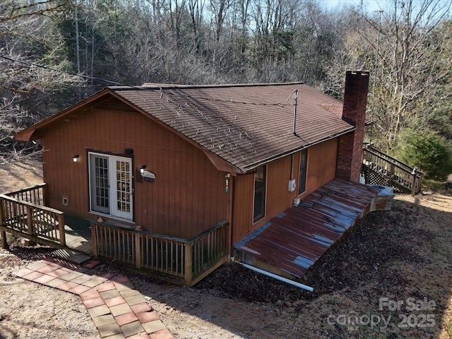 back of property featuring a deck