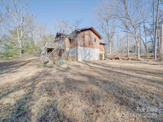 view of home's exterior with a wooden deck