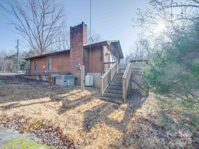 view of property exterior featuring central AC