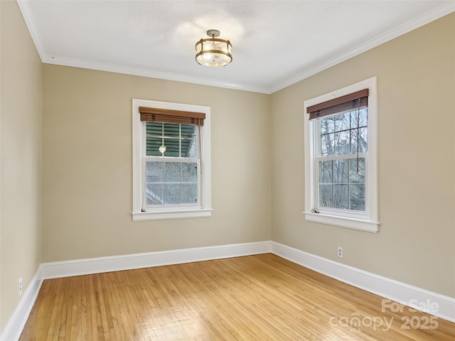 spare room with crown molding and wood-type flooring