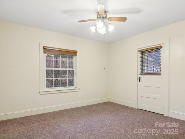 spare room featuring carpet flooring and ceiling fan