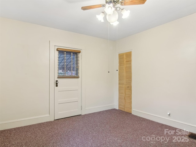 unfurnished room with carpet floors and ceiling fan