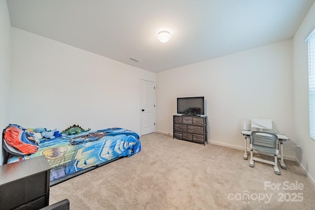 bedroom with light colored carpet