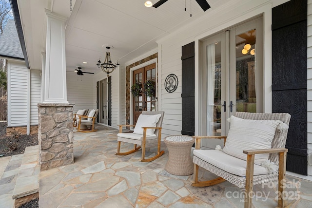 view of patio / terrace with a ceiling fan, french doors, and a porch