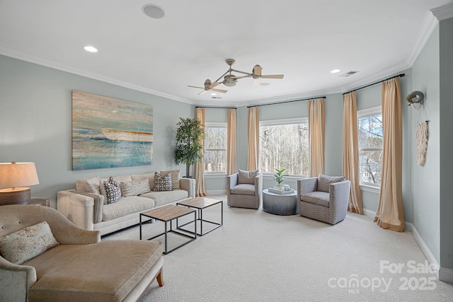 living area featuring baseboards, visible vents, crown molding, and carpet flooring