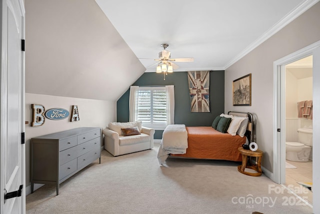 bedroom featuring ensuite bathroom, ceiling fan, light colored carpet, vaulted ceiling, and crown molding