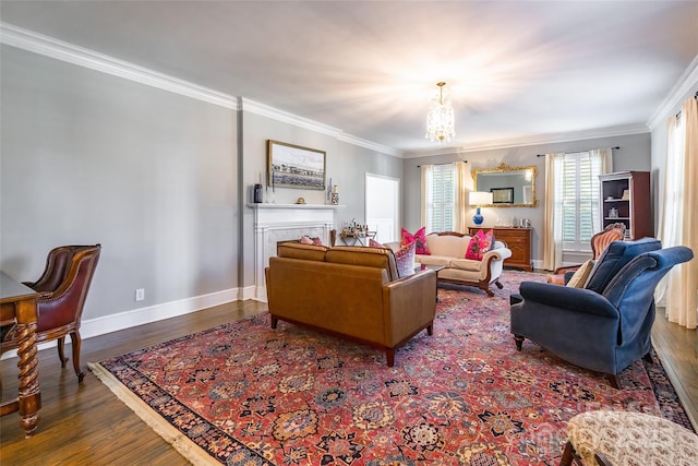 living room with dark hardwood / wood-style flooring, a notable chandelier, and ornamental molding