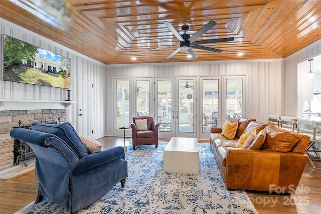 sunroom / solarium featuring ceiling fan and wood ceiling