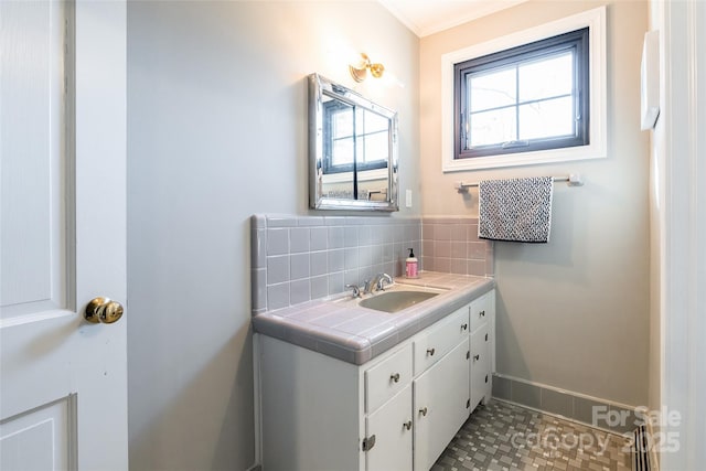 bathroom featuring tasteful backsplash and vanity