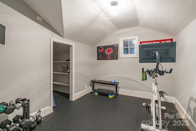 workout room featuring vaulted ceiling