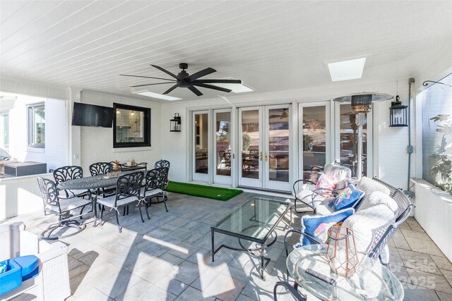 view of patio with ceiling fan and french doors