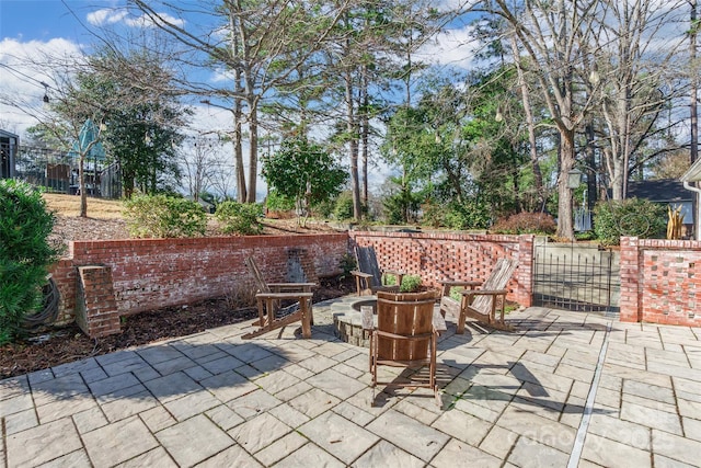 view of patio / terrace with a fire pit