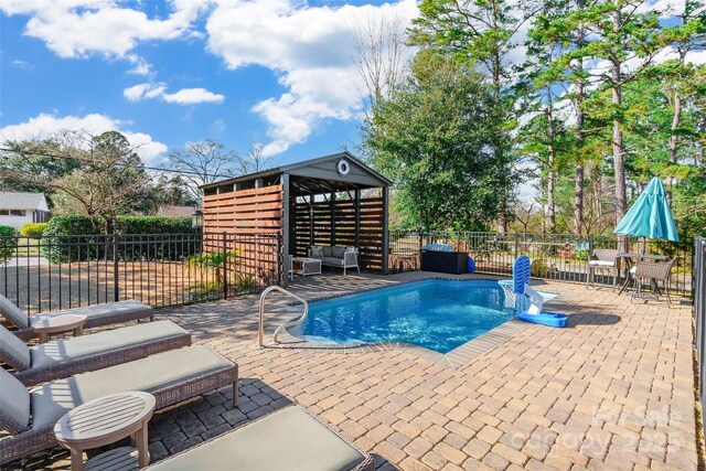 view of pool featuring a gazebo and a patio