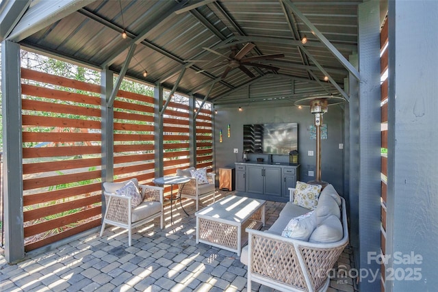 view of patio / terrace with a gazebo and ceiling fan