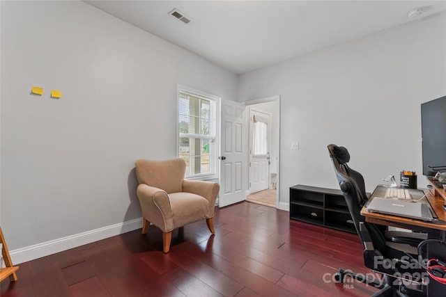 home office featuring dark wood-style floors, visible vents, and baseboards