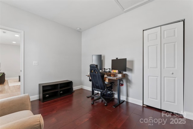 home office with baseboards and dark wood finished floors