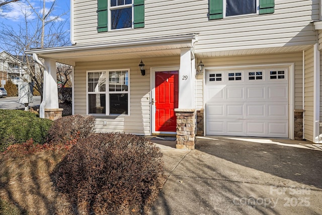 entrance to property featuring a garage