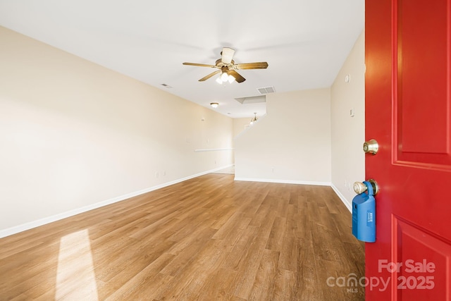 unfurnished room with wood-type flooring and ceiling fan