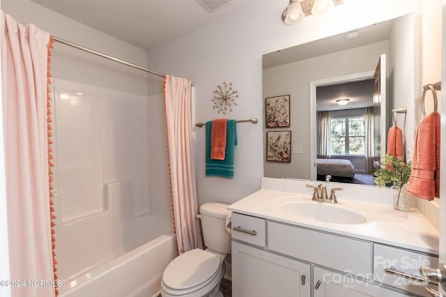 full bathroom featuring vanity, shower / bathtub combination with curtain, and toilet