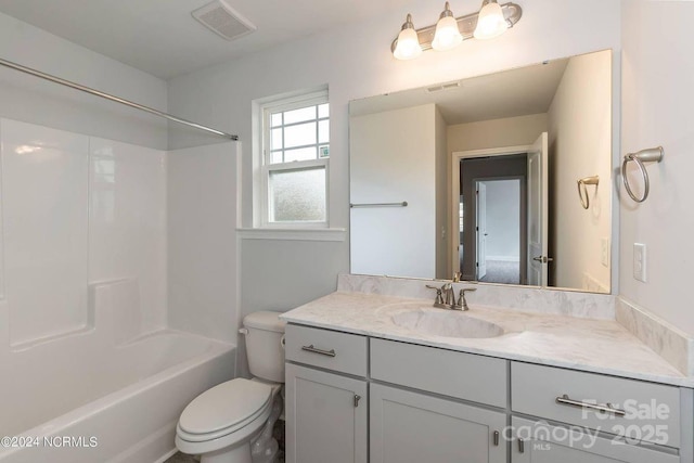 full bathroom featuring vanity, shower / washtub combination, and toilet