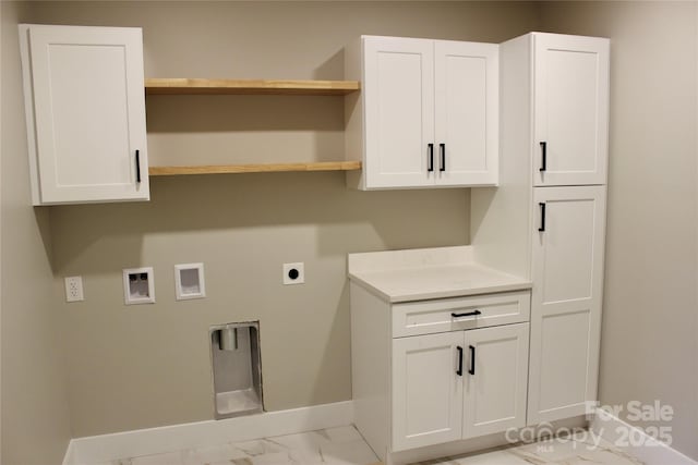 122 Chepstow Pl, Black Mountain, NC 28711 - laundry area with baseboards, hookup for an electric dryer, hookup for a washing machine, marble finish flooring, and cabinet space