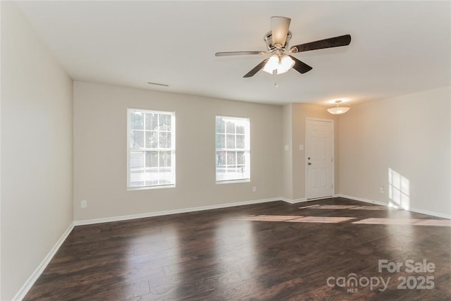 unfurnished room featuring ceiling fan and dark hardwood / wood-style flooring