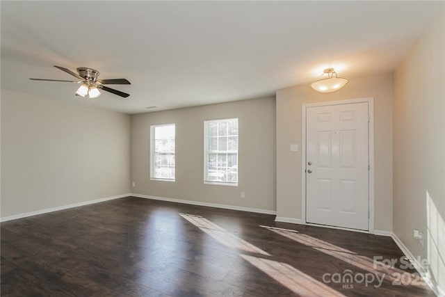 entrance foyer featuring dark hardwood / wood-style flooring and ceiling fan