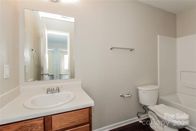 full bathroom featuring vanity, toilet, and shower / washtub combination