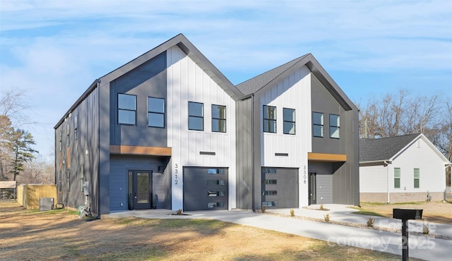 view of front of house featuring cooling unit and a garage