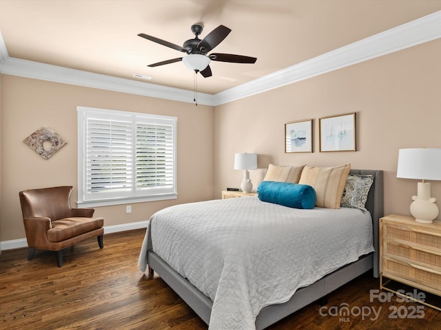 bedroom with wood finished floors, a ceiling fan, visible vents, baseboards, and ornamental molding