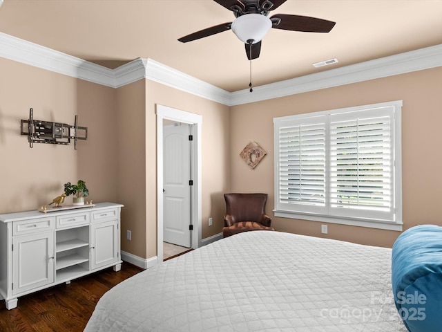 bedroom featuring crown molding, ceiling fan, and dark hardwood / wood-style flooring