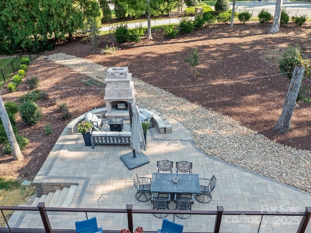 view of patio with an outdoor stone fireplace