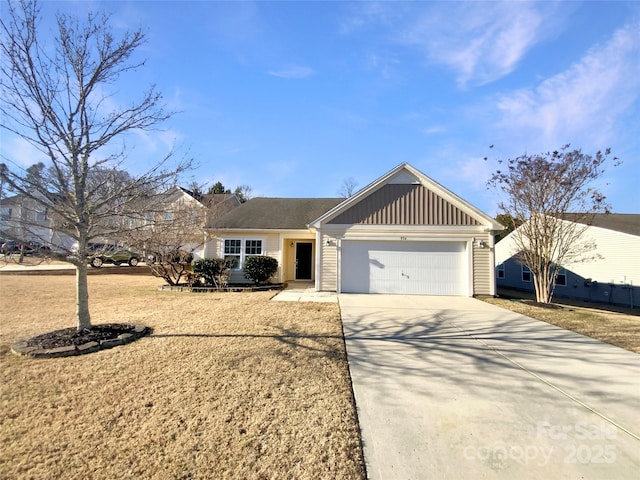 view of front of home featuring a garage and a front lawn