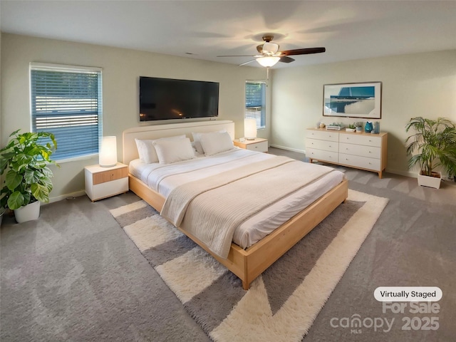 carpeted bedroom featuring ceiling fan