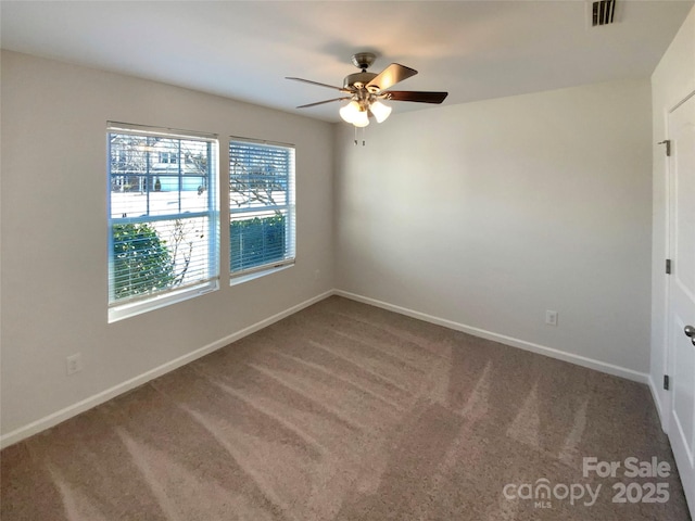 empty room with carpet and ceiling fan