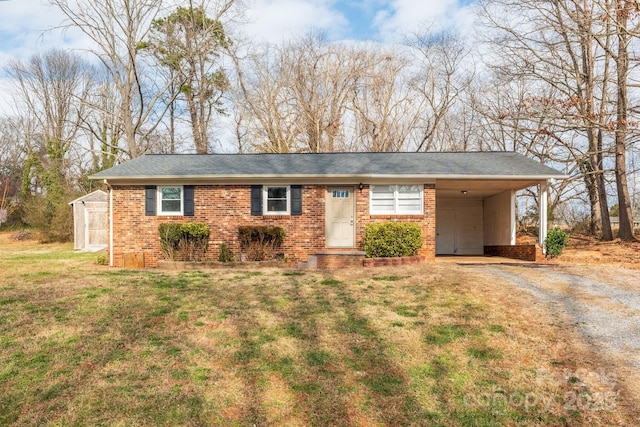 ranch-style home with a carport and a front lawn