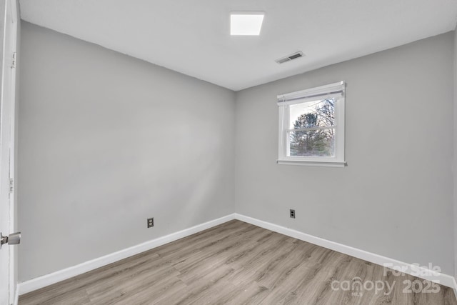 unfurnished room featuring light hardwood / wood-style flooring