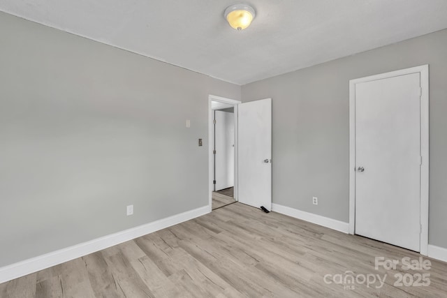 unfurnished bedroom featuring light hardwood / wood-style floors