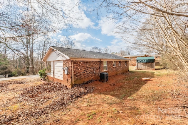 view of side of home featuring cooling unit