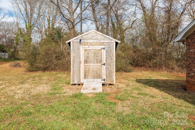 view of outdoor structure with a lawn